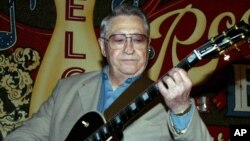 FILE - Scotty Moore, a former guitarist for Elvis Presley, playing music at the 2nd annual Ponderosa Stomp in New Orleans.