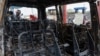 A person inspects the remains of a vehicle hit by heavy and light weapons during the fighting in the town that led to the fall of Goma into the hands of the M23 rebels, eastern Democratic Republic of Congo, Feb. 5, 2025. 