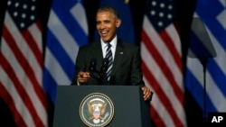 U.S. President Barack Obama laughs as he delivers a speech at the new opera of Athens on Nov. 16, 2016. 