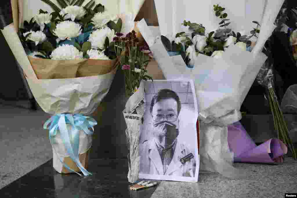 A makeshift memorial for Li Wenliang, a doctor who issued an early warning about the coronavirus outbreak before it was officially recognized, is seen after Li died of the virus, at Central Hospital of Wuhan in Hubei province, China. Feb. 7, 2020.