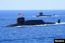 FILE - A nuclear-powered Type 094A Jin-class ballistic missile submarine of the Chinese People's Liberation Army's navy is seen during a military display in the South China Sea, April 12, 2018.