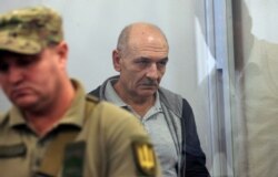 FILE - Volodymyr Tsemakh, former commander of Russian-backed separatist forces in eastern Ukraine, sits in a court room in Kyiv, Ukraine, Sept. 5, 2019. Tsemakh was one of two high-profile prisoners returned Russia.