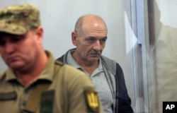 FILE - Volodymyr Tsemakh, former commander of Russian-backed separatist forces in eastern Ukraine, sits in a court room in Kyiv, Ukraine, Sept. 5, 2019. Tsemakh was one of two high-profile prisoners returned Russia.