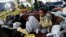 A child traveling with a caravan of migrants from Central America sits at a camp near the San Ysidro checkpoint, after U.S. border authorities allowed the first small group of women and children entry from Mexico overnight, in Tijuana, Mexico, May 1, 2018.