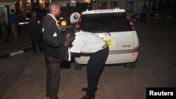 Uganda security checks people entering Victoria Mall in Entebbe near Entebbe airport, about 42 kilometers southeast of the capital Kampala, Uganda, July 3, 2014.