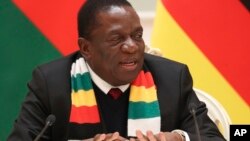 FILE - Zimbabwe's President Emmerson Mnangagwa speaks during a meeting with Belarus' President Alexander Lukashenko in Minsk, Belarus, Jan. 17, 2019. 