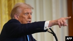 TOPSHOT - US President Donald Trump speaks during a press conference with unseen Israel's Prime Minister Benjamin Netanyahu in the East Room of the White House in Washington, DC, on February 4, 2025. (Photo by ANDREW CABALLERO-REYNOLDS / AFP)