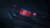노트북에 새겨진 북한의 디지털 기술 국기 일러스트레이션 (이미지=Adobe Stock)
