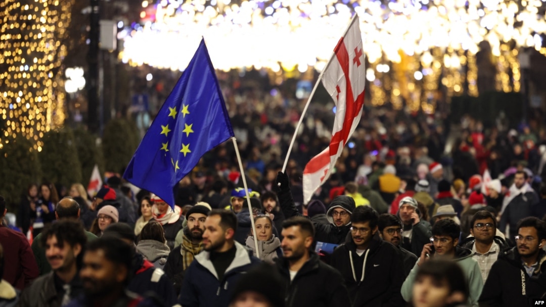 Anti-government demonstrators protest against the Georgian government's postponement of European Union accession talks until 2028, outside the parliament in central Tbilisi on Dec. 31, 2024
