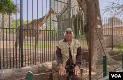 Nady Abdulhalim Mahmoud, a zookeeper, is anxious for public life to start again but fears the virus, in Giza, Cairo, April 16, 2020. (Hamada Elrasam/VOA)