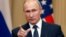 Russian President Vladimir Putin gestures during a joint news conference with U.S. President Donald Trump (not pictured) after their meeting in Helsinki, Finland July 16, 2018.