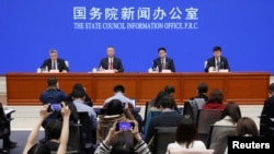 Officials of Ministry of Public Security, National Health Commission and National Medical Products Administration attend a news conference on fentanyl-related substances control, in Beijing, China April, 1, 2019. REUTERS/Stringer ATTENTION EDITORS -…