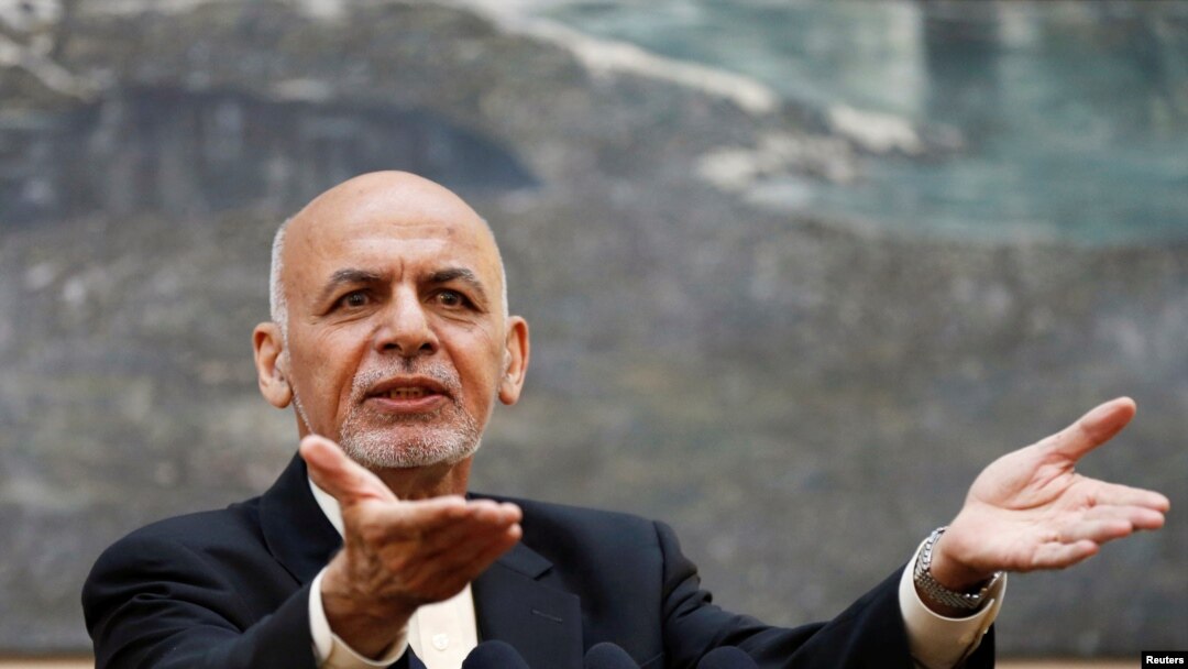 FILE - Afghan President Ashraf Ghani speaks during a news conference in Kabul, Afghanistan, July 15, 2018. He telephoned neighboring Pakistan’s would-be prime minister, Imran Khan, to congratulate him on his election victory and invited him to visit Kabul. 