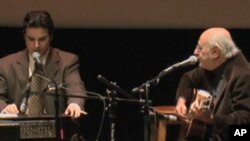 American songwriter Peter Yarrow singing in English and Afghan Humayun Khan, in Pashto, at the Search for Common Grounds peace awards ceremony.