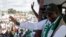 FILE - Liberia's opposition Unity Party Joseph Boakai waves to his supporters as holds his final campaign rally for the presidential elections in Monrovia, Liberia October 7, 2023. 