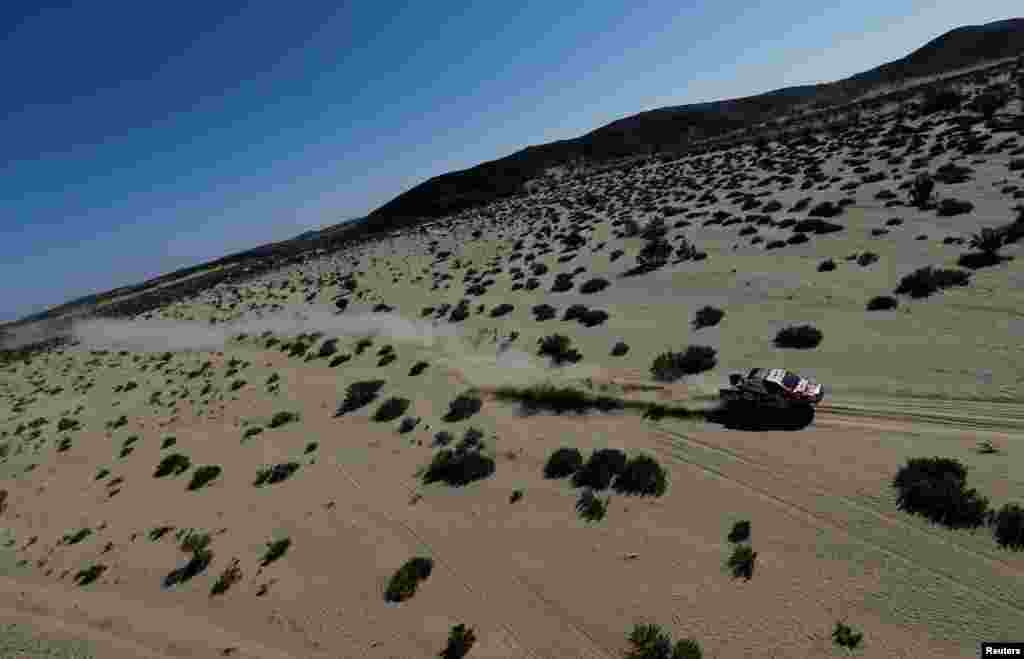 Toyota Gazoo Racing&#39;s Nasser Al-Attiyah and Co-Driver Matthieu Baumel compete during Stage 1 of the Dakar Rally between Jeddah and Bisha in Saudi Arabia.