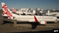 Pesawat milik maskapai penerbangan Virgin Australia terlihat di bandara Sydney, 5 Agustus 2020.