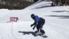 Snowboarder Brolin Mawejje trains in Utah in this undated image taken from a video on his Instagram account.