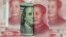 FILE - U.S. 100-dollar banknote featuring American founder Benjamin Franklin and a Chinese 100-yuan banknote featuring late Chinese chairman Mao Zedong are seen in this picture illustration.