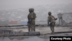 Gaashaan soldiers shortly after re-taking control of the Somali parliament building from al-Shabab fighters in on May 24, 2014. (Somalia Handout Photo)