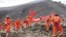 Rescuers search for survivors at the site of a landslide in a mining area in Maizhokunggar County, Tibet Autonomous Region, March 30, 2013. Rescuers found the first body at 1735 local time (0935 GMT) on Saturday, nearly 36 hours after a massive landslide 