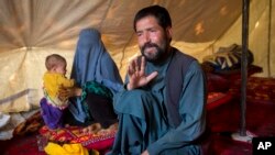 Mohammad Azam, father of Zahra, 14, who died after she was set on fire in her husband's home, talks during an interview in a tent in Kabul, Afghanistan, July 18, 2016. 
