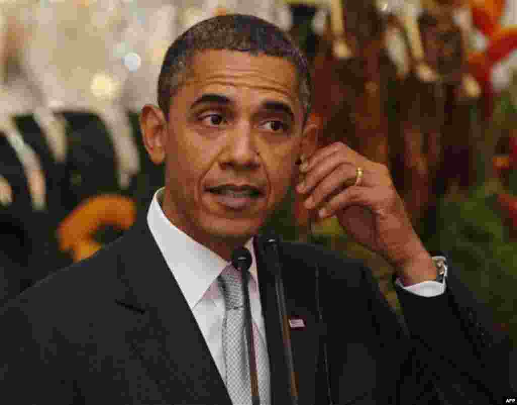 U.S President Barack Obama adjusts his earphone during a news conference after his meeting with his Indonesian counterpart Susilo Bambang Yudhoyono at the Merdeka palace in Jakarta, Indonesia, Tuesday Nov. 9, 2010. (AP Photo, Enny Nuraheni, Pool)