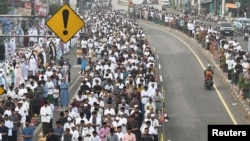 Indonesian Muslims offer mass prayers on the street during Eid al-Adha celebrations in Bekasi, on the outskirts of Jakarta, Indonesia, June 17, 2024, in this photo taken by Antara Foto. 