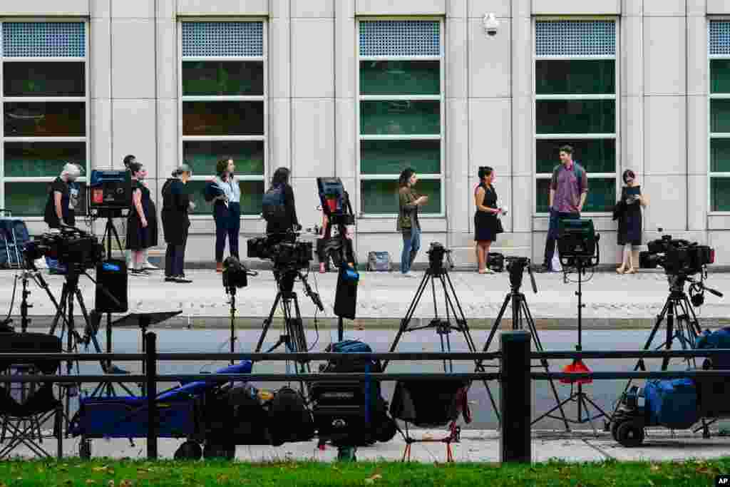 Television reporters and spectators line up outside Brooklyn Federal court for opening statements in R&amp;B star R. Kelly&#39;s long-anticipated federal trial in New York, arising from years of allegations that he sexually abused women and girls.