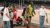 Jamaica's Usain Bolt walks away after being hit by a videographer on a Segway as Bolt celebrated winning the men’s 200m final at the World Athletics Championships at the Bird's Nest stadium in Beijing, Aug. 27, 2015.