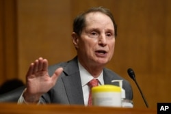 FILE - Sen. Ron Wyden at a Senate Finance Committee hearing on Capitol Hill in Washington, June 30, 2020.