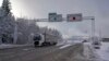 FILE - A truck passes the Norwegian border toward Sweden on Feb. 8 2019. Norway announced on Oct. 12, 2024, that it is instituting temporary border checks until Oct. 22 because its terror threat level was recently raised.