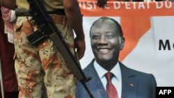 A soldier from the United Nations Operation in Côte d'Ivoire (UNOCI) stands guard before the arrival of Ivory Coast's President in Duekoue on April 23, 2012. President Alassane Ouattara vowed that all those behind killings during Ivory Coast's post-poll c