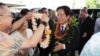 Taiwan President Lai Ching-te, right, receives a flower lei from members of the Taiwanese American community at the Kahala Hotel and Resort in Honolulu, Hawaii, Nov. 30, 2024.