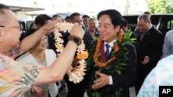 Taiwan President Lai Ching-te, right, receives a flower lei from members of the Taiwanese American community at the Kahala Hotel and Resort in Honolulu, Hawaii, Nov. 30, 2024.