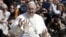 Pope Francis waves as he leaves after the Palm Sunday mass at Saint Peter's Square at the Vatican, March 24, 2013. 