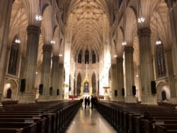 The nearly empty interior of St. Patrick's Cathedral is seen in New York, March 17, 2020. (Margaret Besheer/VOA)