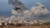 This picture taken from the Israeli side of the border with the Gaza Strip shows smoke plumes rising from explosions above destroyed buildings in the northern Gaza Strip on Jan. 13, 2025 amid the ongoing war between Israel and Hamas.