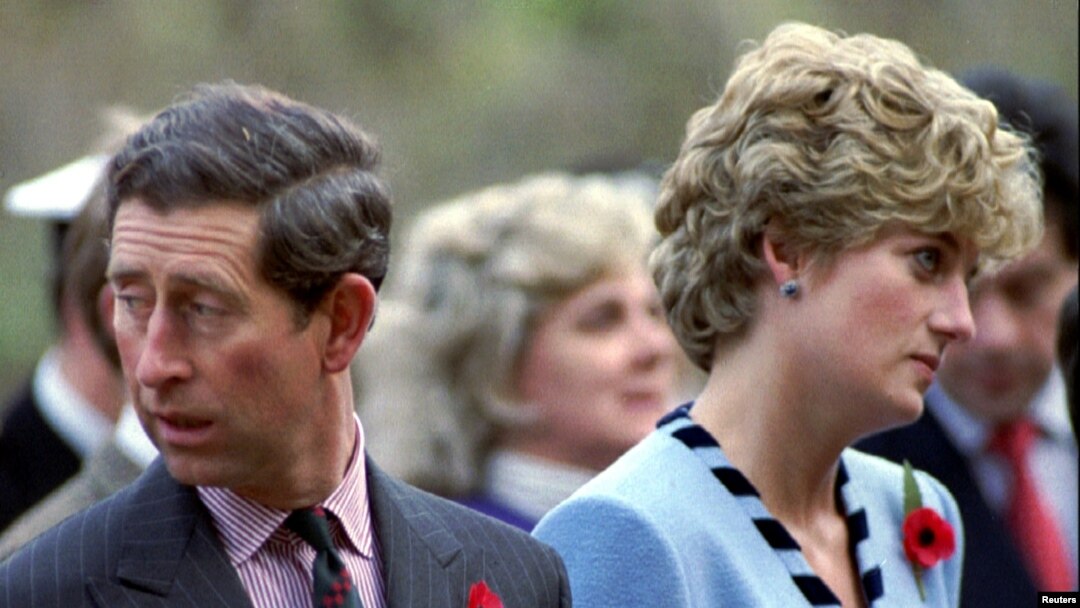 FILE - Princess Diana and Prince Charles look in different directions, Nov. 3, during a service held to commemorate the 59 British soldiers killed in action during the Korean War, Nov. 3, 1992. 