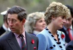 FILE - Princess Diana and Prince Charles look in different directions, Nov. 3, during a service held to commemorate the 59 British soldiers killed in action during the Korean War, Nov. 3, 1992.
