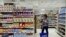 FILE - A woman shops at a supermarket in Cairo, Egypt. 