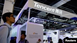 FILE - Tencent sign is seen at the World Artificial Intelligence Conference in Shanghai, China July 6, 2023.