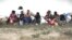 Villagers of Balinuraga sit and rest after they fled from their homes following ethnic clashes in Lampung province, Indonesia, October 30, 2012.