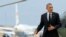President Barack Obama walks toward Air Force One at Andrews Air Force Base in Md., May 7, 2014. 