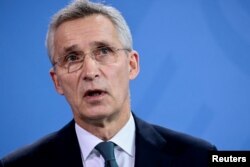 FILE PHOTO: NATO Secretary General Stoltenberg and German Chancellor Scholz attend a news conference, in Berlin