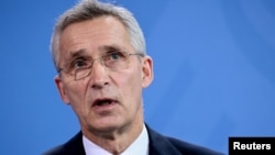 FILE PHOTO: NATO Secretary General Stoltenberg and German Chancellor Scholz attend a news conference, in Berlin