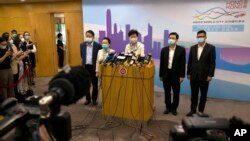 Hong Kong Chief Executive Carrie Lam speaks during a press conference after meeting Chinese leadership in Beijing, June 3, 2020. British PM Boris Johnson said the United Kingdom stands ready to open the door to almost 3 million Hong Kong citizens.