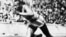 FILE - Jesse Owens competes in one of the heats of the 200-meter run at the 1936 Olympic Games in Berlin.