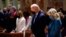 FILE - Then-President-elect Joe Biden and his wife, Jill Biden, attend Mass at the Cathedral of St. Matthew the Apostle during Inauguration Day ceremonies in Washington, Jan. 20, 2021.