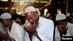 A Rohingya refugee cries during Eid al-Adha prayers in Kutupalong refugee camp in Cox’s Bazar, Bangladesh, Aug. 22, 2018. 